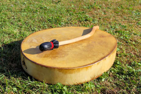 Shaman tambourine by the fire at a festival in estonia