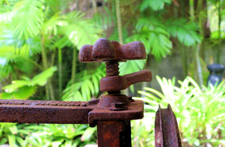 An old iron mechanism to extract juice from sugarcane