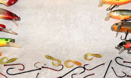 Set of fishing lures and equipment for fishing, on a wooden backgroundの写真素材