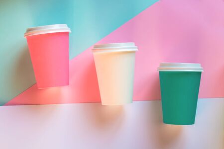 Colored coffee cups on a colored background.の写真素材