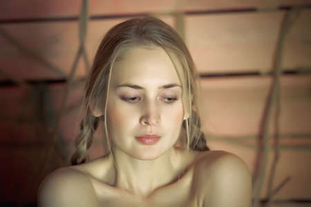 Close-up girl face with braids.の写真素材