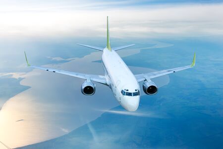 Passenger plane in flight. Aircraft flies high above the river.