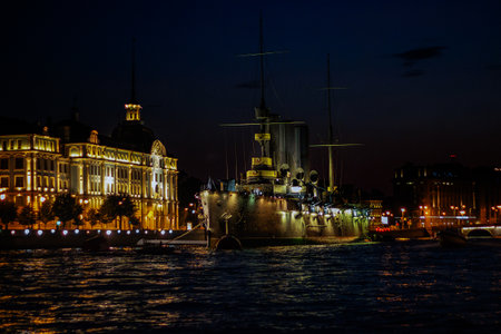 Saint Petersburg, Russia, July 2021: Ship Aurora in St. Petersburg at night. Night landscape of the Neva River and Aurora.のeditorial素材