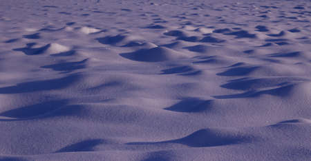 Trendy Color of the year 2022 Very Peri. Snowy white background. Texture of the snow. Shiny snow...