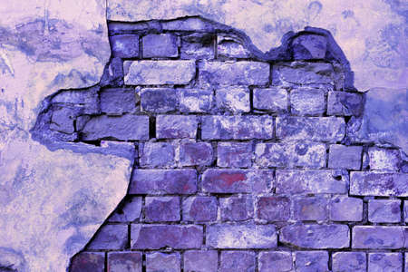 Trendy Color of the year 2022 Very Peri. Brick background grunge texture. Stone lilac brick wall....