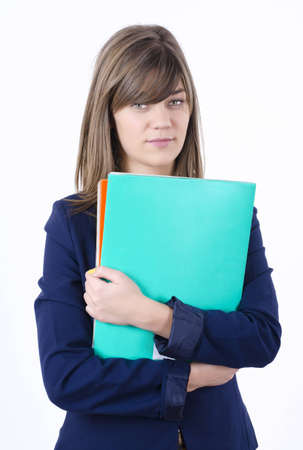 cute young business woman in a jacket with a green and orange folders in handsの写真素材