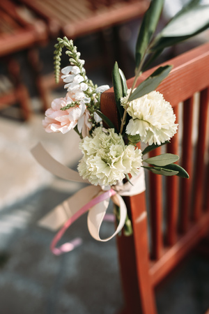 chair decorated with flowers on the wedding ceremonyの写真素材
