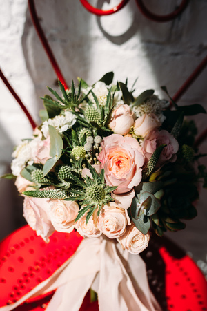 Wedding flowers on the red chairの写真素材