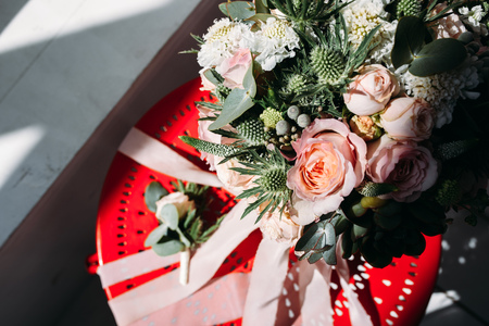 Wedding flowers on the red chairの写真素材