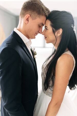 Love you forever. The bride and groom look at each other with loveの写真素材