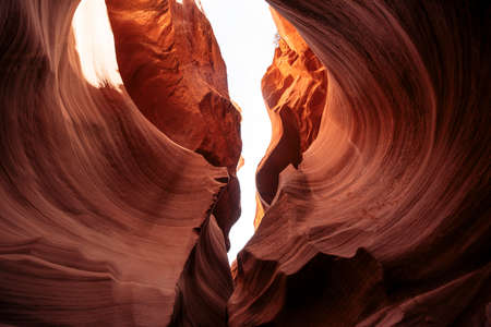 Breathtaking view of curves of antelope canyon. The awesome winding fissure in the red rock with a sky view in Arizonaの写真素材