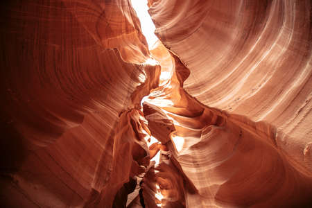 Breathtaking view of curves of antelope canyon. The awesome winding fissure in the red rock with a sky view in Arizonaの写真素材