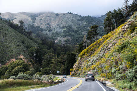 Winding mountain road surrounded high rocks, California, USAの写真素材