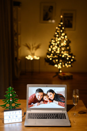 Videocall on the laptop in Christmas dayの写真素材