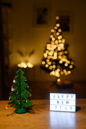 Stay at home box and Christmas tree on the tableの写真素材