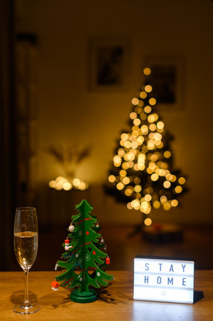 Stay at home box and Christmas tree on the tableの写真素材