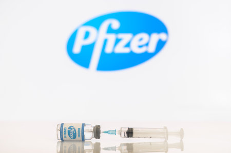 A bottle of new pfizer vaccine and a syringeのeditorial素材