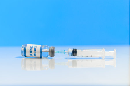 An injection syringe and a coronavirus vaccineの写真素材