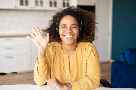 Video meeting with call center representative. Headshot of charming smiling African woman in...