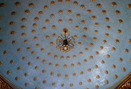 Blue spherical ceiling with gold decor and chandelierの写真素材