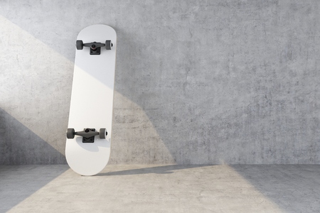 white skateboard on concrete wall background. 3d renderingの写真素材