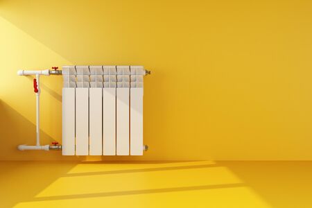 radiator heating on yellow wall. 3d renderingの写真素材