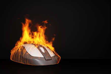 burning computer mouse on a black background copy space. 3d renderingの写真素材
