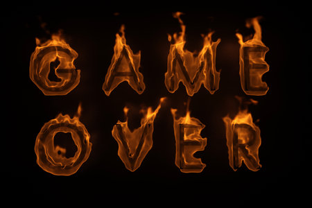 burning words game over isolated on black. 3d renderingの写真素材
