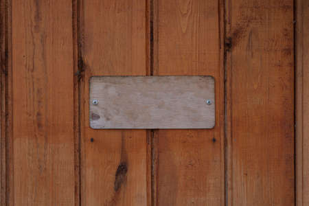 wood sign on wood plank backgroundの写真素材