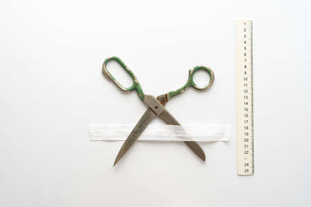 Flat lay composition with sewing scissors on white background.の写真素材