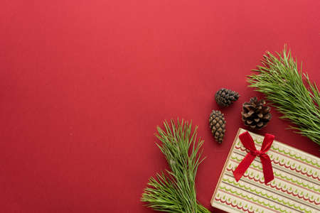 Christmas composition. Christmas decoration white tinsel on a red background. Flat lay, top view, space for textの写真素材