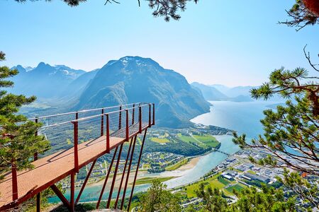 Observation deck Rampestreken in Andalsnes, Norway. Beautiful view on the mountains, the city and the fjords. Tourist place in Norway.の写真素材
