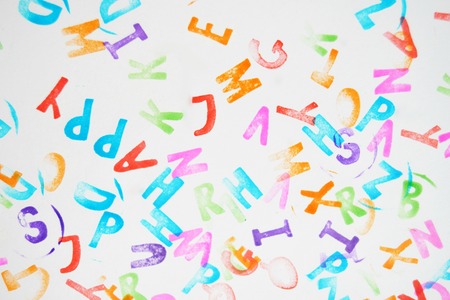 Favourite colored alphabet stamps for children on a white backgroundの写真素材