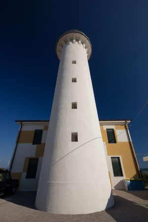 Tall lighthouse with nice dark blue skyの写真素材