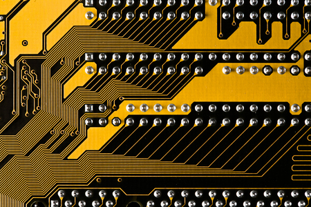 Macro picture of yellow printed circuit board - PCB textureの写真素材