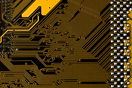Macro picture of yellow printed circuit board - PCB texture