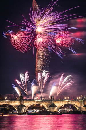 A fireworks show near the historical Charles Bridge in the centre of Pragueの写真素材