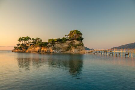 Beautiful sunrise at the famous Cameo island. A beautiful small island with wooden bridge and...