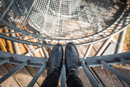 View from the tower down on the stairs and shoes from aboveの写真素材