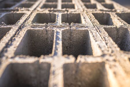 Concrete block bricks in stack for wall construction. Concrete block, cinder blocks, breeze blocks,...
