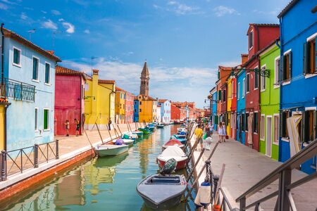 Street canal in Burano island, Venice, Italy, July 2012 - Narrow canal among old colorful brick houses in Burano, Venice. Burano postcardのeditorial素材