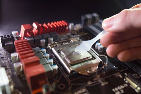 Application of thermal paste on the laptop processor chip for high-quality cooling