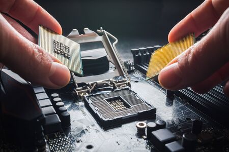 Prague, Czech Republic, January 2019 - Intel verus AMD concept. Hands show different processors. The choice of processor, Ryzen processor on rise. Processor brands war concept.のeditorial素材