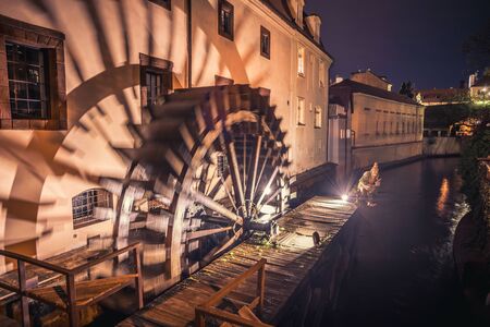 Historic water mill on Kampa Island in Prague, Czech Republic. Branch of the Vltava river, the Certovka or Devils Stream. Famous place in Pragueの写真素材