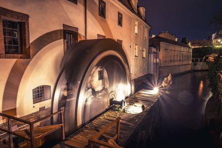 Historic water mill on Kampa Island in Prague, Czech Republic. Branch of the Vltava river, the Certovka or Devils Stream. Famous place in Pragueの写真素材