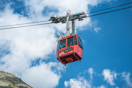 TATRANSKA LOMNICA, SLOVAKIA, AUGUST 2020 - Red cabin of cableway from Skalnate pleso to peak Lomnicky Stit in High Tatras mountainsのeditorial素材