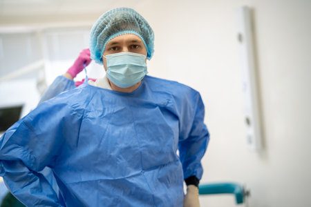 Dentist in medical uniform in stomatological cabinetの写真素材