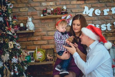 Cute yang family prepare for christmas with their little son