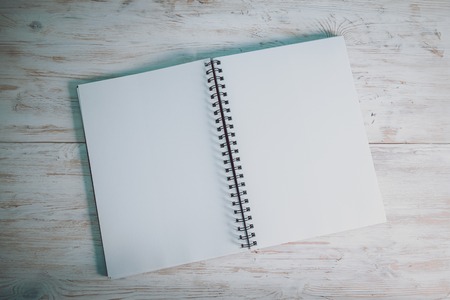 opened notebook on the deskの写真素材