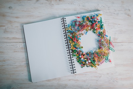 notebook with clips on the desk